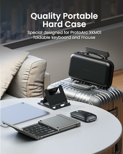 Portable hard case with foldable keyboard and mouse on table.