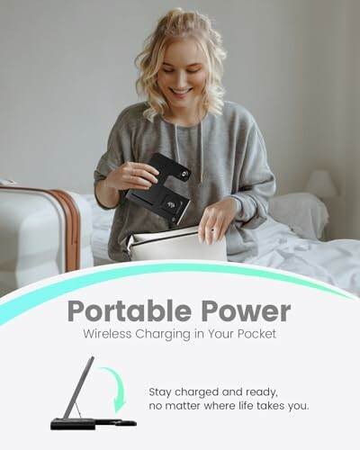 Woman using portable wireless charger in bedroom.