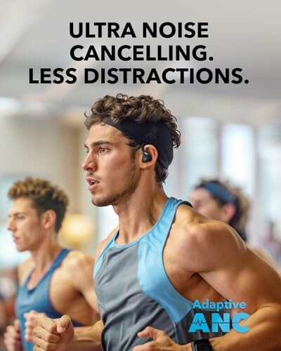 Man wearing noise-cancelling headphones in a gym setting.