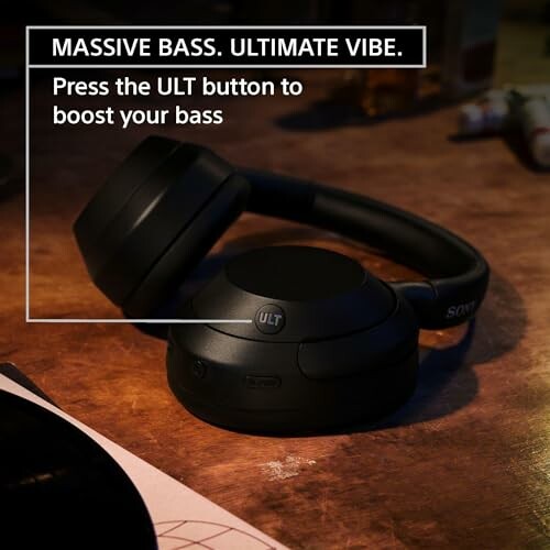 Wireless headphones with bass boost feature on a table.